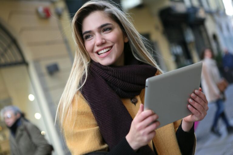 Woman Wearing Brown Coat and Maroon Scarf